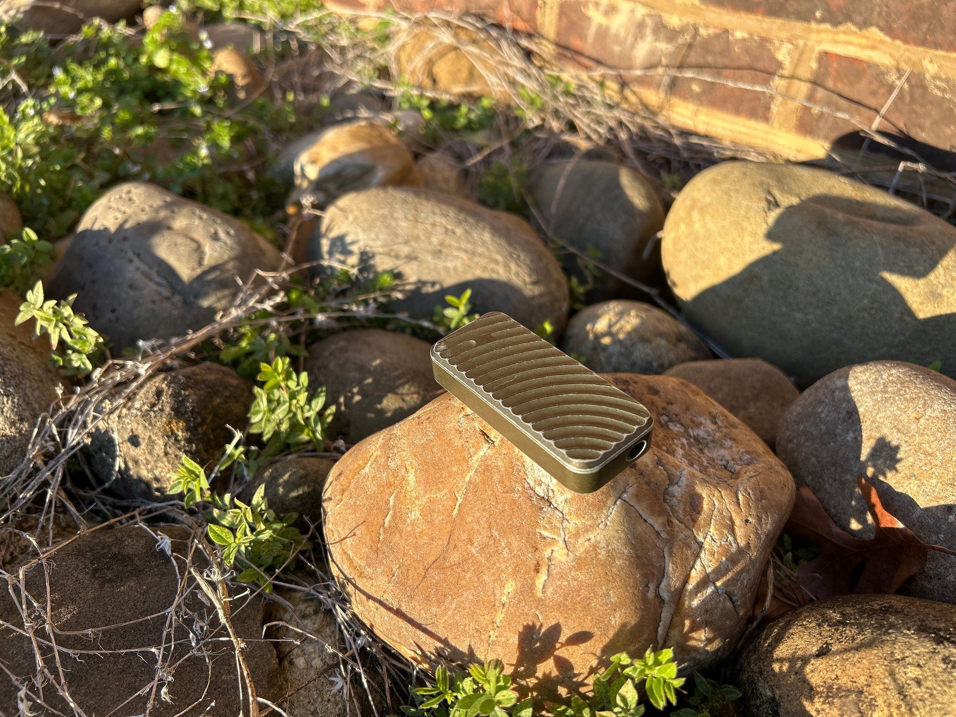 Gold RiveryMFG Zero Grenade Pattern-6061 Aluminum utility knife.