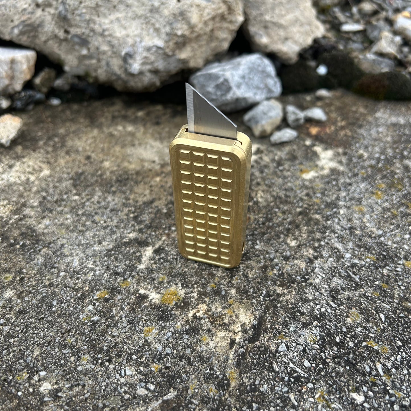 Zero V2 Brass with a grenade milling pattern with a rustic background