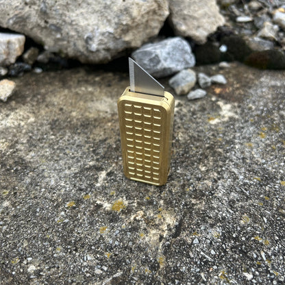 Zero V2 Brass with a grenade milling pattern with a rustic background