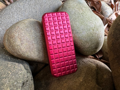 Red retractable Zero utility knife by RiveryMFG with grenade pattern