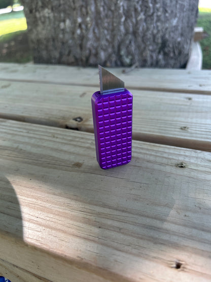 RiveryMFG Zero BLEM Purple CadLab collaboration utility knife with file pattern