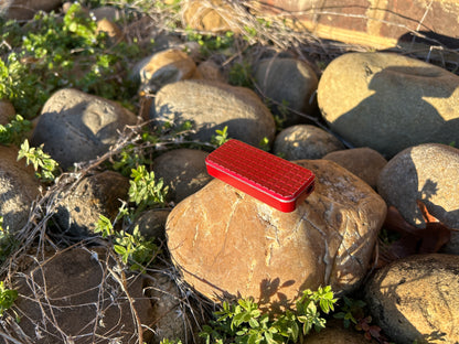 Red RiveryMFG Zero Grenade Pattern-6061 Aluminum utility knife.