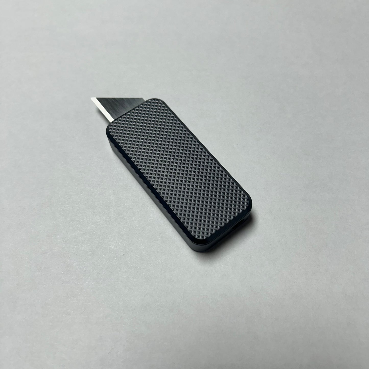 RiveryMFG Zero Gun Metal Gray CadLab collaboration utility knife with knurl pattern